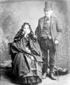 [Elderly man standing, women seated, full-length portrait, Waterford]