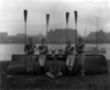 [Members of Waterford boat club holding oars]