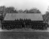 [Royal Irish Constabulary group and Mr. W. Gamble, taken in front of a corrugated building]