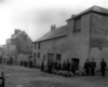 [Men standing outside Mr. L.A. Ryan's premises, shows John Jameson & Sons barrels, Thomas Street, Waterford]