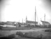 [Boats moored along side harbour industry, Tralee, Co. Kerry]