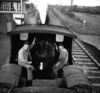 [Interior view of driving cab with two drivers on train passing through Straffan railway station, Co. Kildare]