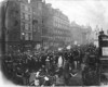 [Crowds of spectators observing a parade passing through O'Connell Street]