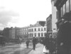 [View of pedestrians, shopfronts and horse and carts on Patrick Street, Cork]