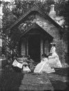 [Family group outside the photograph house, Augusta Caroline Dillon with daughter Georgiana at her feet, Edward Crofton and Katie and Georgiana Dillon]