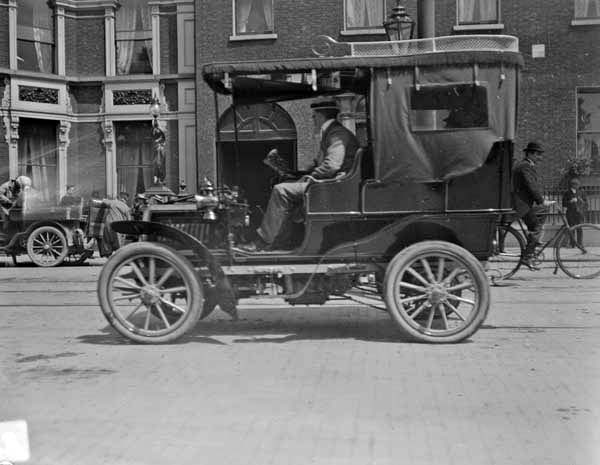 Hooded car outside the Shelbourne Hotel, St. Stephen's Green. Car is possibly a 12 hp Panhard and it is fitted with a Brougham body with an&nbsp;...