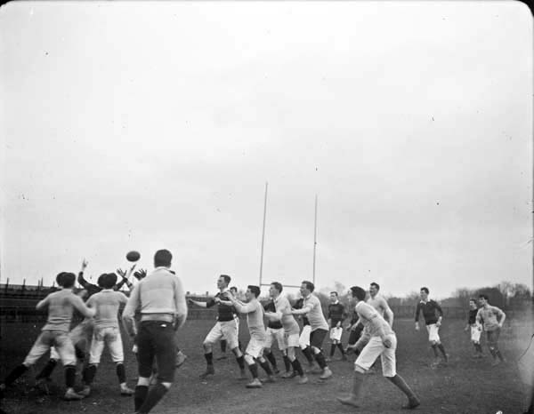 Young men playing rugby