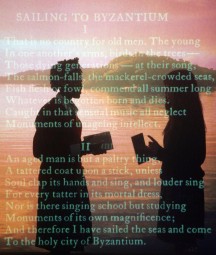 Image of students behind screen of text inside the Yeats exhibition at the NLI