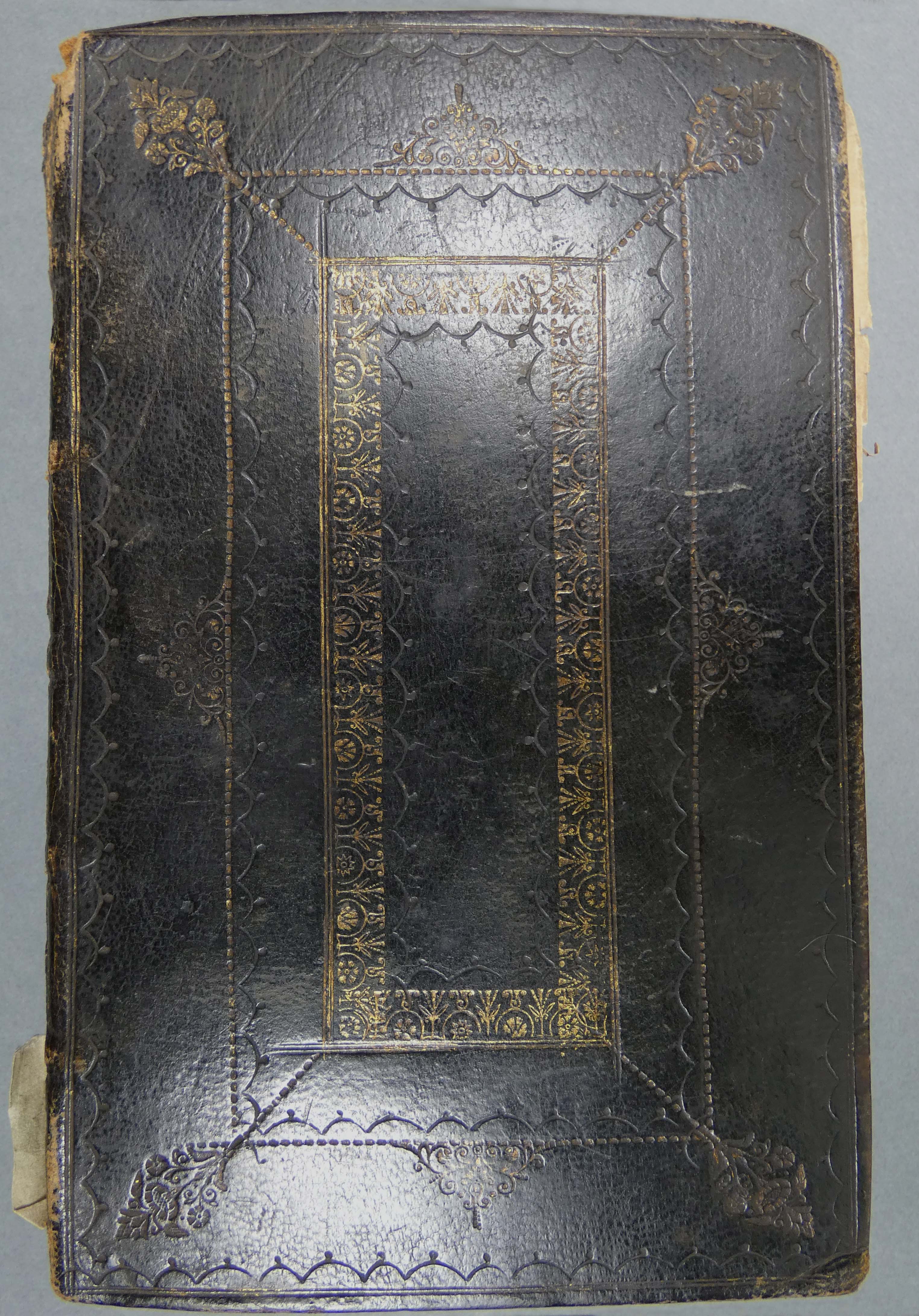 Closed manuscript volume with black cover (MS 2104)