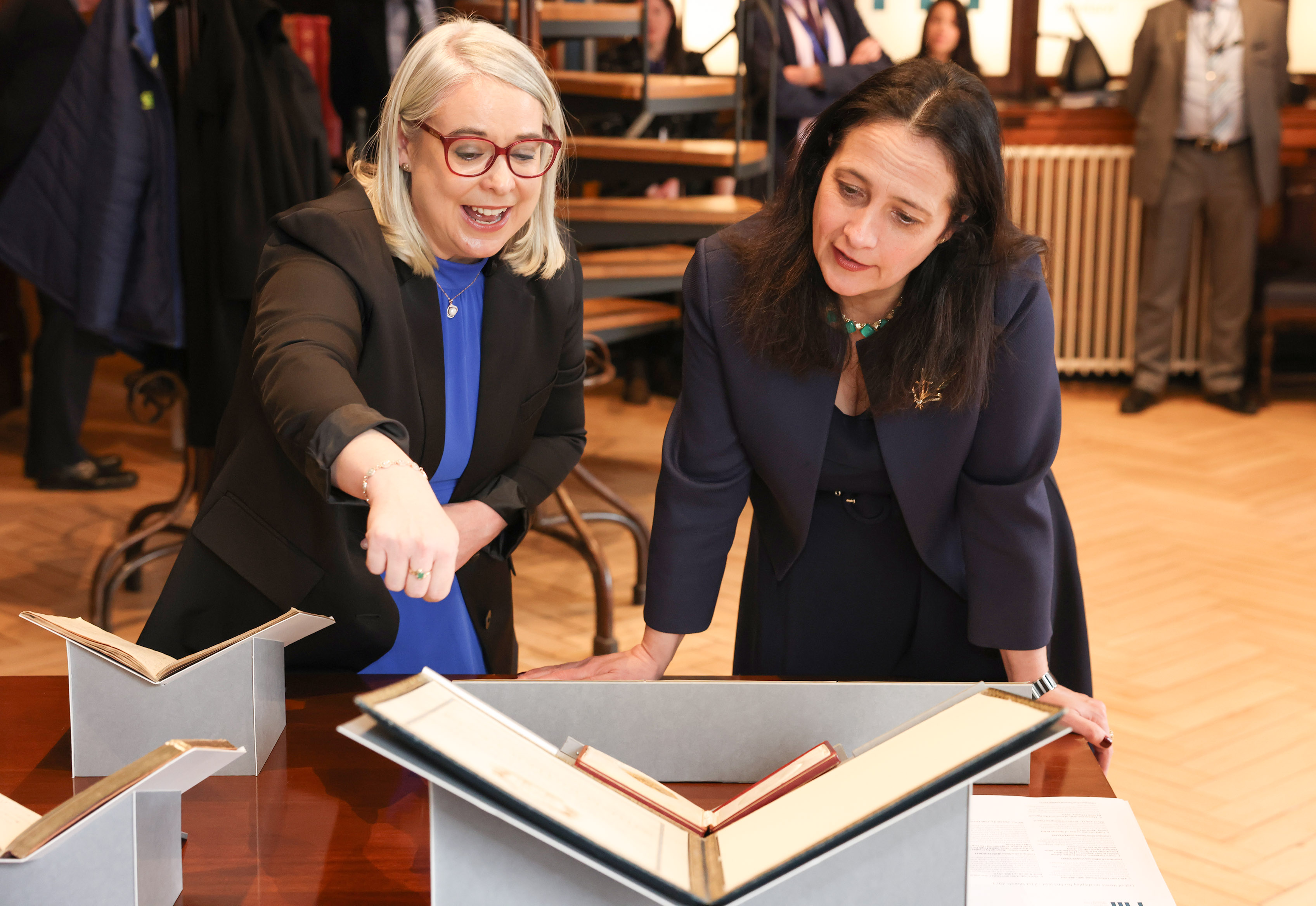 Dr Whitty and Minister Martin view and discuss the significance of the collection items on display.