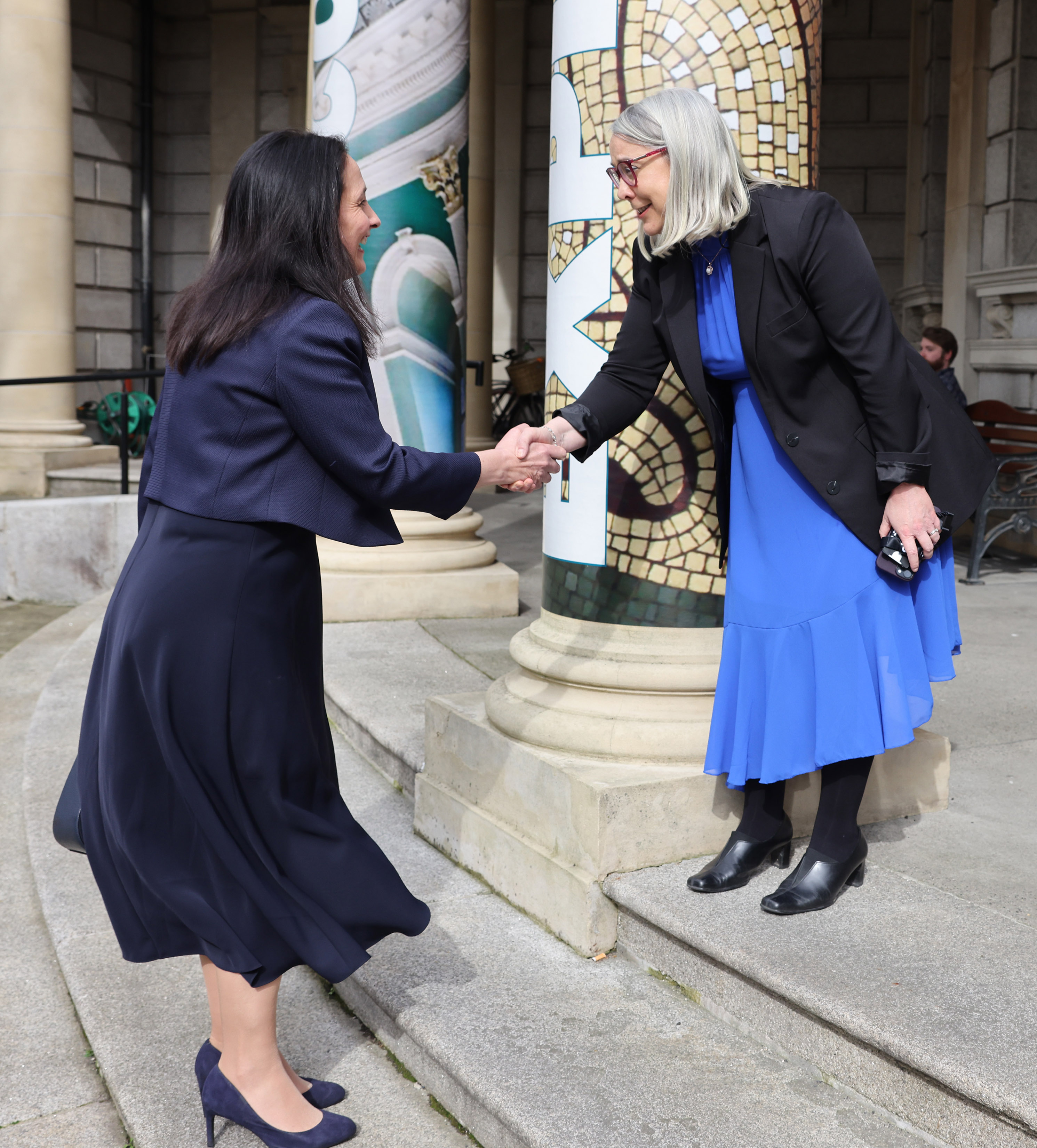 1.	NLI Director, Dr Audrey Whitty welcomes Minister Martin, T.D. at the front steps of the National Library of Ireland.
