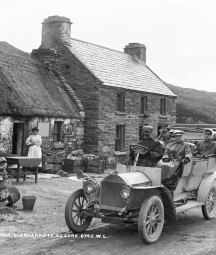 From our Lawrence Cabinet photographs - Tourists motoring past Long Tunnel Cottage, Glengariff, Co. Cork, circa 1906/07. NLI ref. LCAB 08742