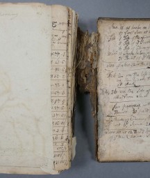 Old book on table with handwriting - MS 2104 is a volume of manuscript maps, dated c. 1750