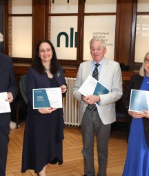 Standing left to right, Dr Martin Mansergh, Minister Catherine Martin, Dr Maurice Manning and NLI Director Audrey Whitty holding printed programme of events