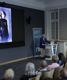 Man giving lecture to a group of people