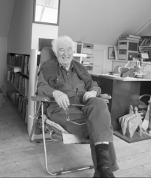 Seamus Heaney sitting in his chair in this office