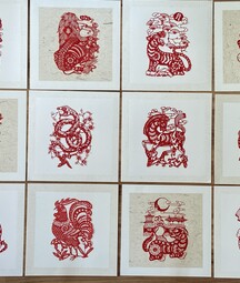 red woodblock prints of zodiac characters
