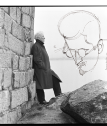 Heaney standing in front of the sea with sketch of joyce