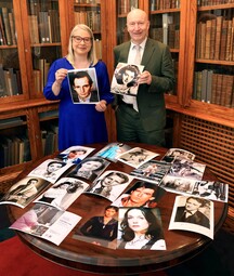Dr Audrey Whitty and Liam Bluett with a collection of his photos