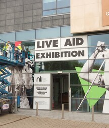 Live Aid Exhibition Decal on Exterior of Office Space 