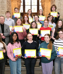 Group of young TY Reveal students holding certificates