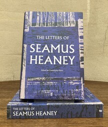 A photo of the book 'The Letters of Seamus Heaney' against a marble background
