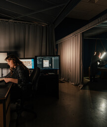 Behind the scenes view of NLI staff working on digitisation projects.