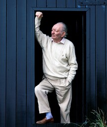 brian friel at his boathouse, standing in the doorway