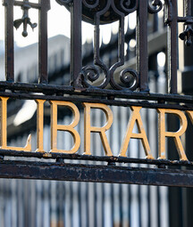 National Library of Ireland main entrance gate with black railings and gold lettering