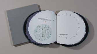 Photo of circular book with hand-coloured etchings showing the words 'Sandymount Strand'.