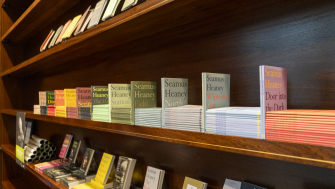 Photo of bookshelf full of colourful books.