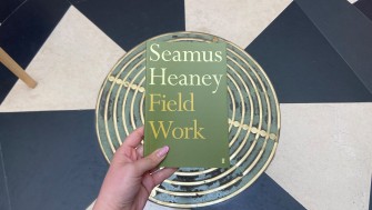 photograph of seamus heaney's poetry collection Field Work. The collection cover is mossy green with simple text. 