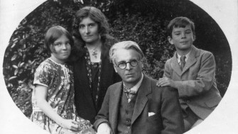Black and white photograph of WB Yeats and his young family. From left to right , is his daughter Anne, his wife Georgie, WB Yeats and his son Michael.