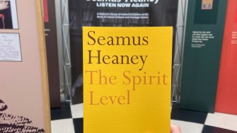 a copy of seamus heaney's poetry collection 'the spirit level' in the exhibition entrance 