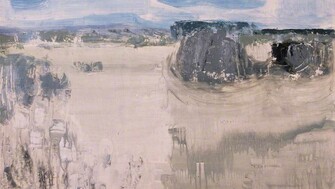 Abstract landscape painting titled Fermanagh Field I by Terence Philip Flanagan. The artwork depicts a pale, textured field rendered in muted tones of beige, grey, and white, with expressive brushstrokes suggesting land and sky. A soft blue sky with streaks of white looms over darker, indistinct shapes resembling distant trees or rocks, creating a sense of open space and quiet atmosphere.