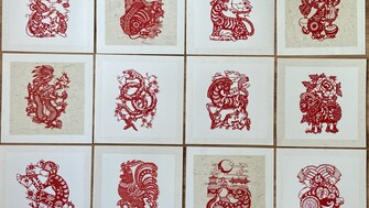 red woodblock prints of zodiac characters