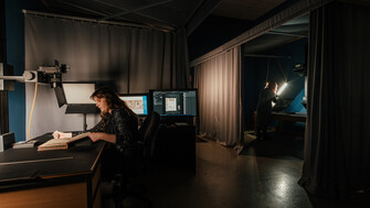 Behind the scenes view of NLI staff working on digitisation projects.