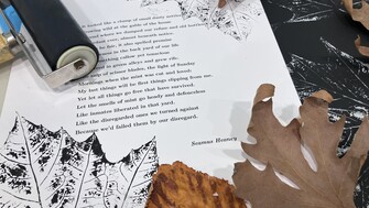 An image of autumn leaves and printing equipment and printed leaves on poems.