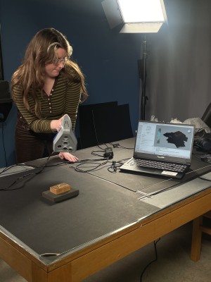 NLI staff using the 3D scanner on woodblock