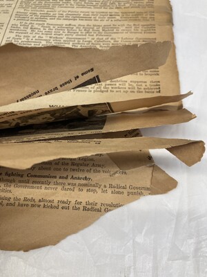 Newspaper before conservation treatment