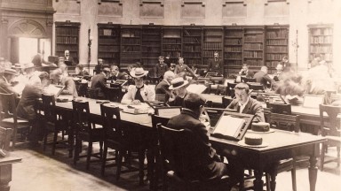 A sepia photo of the NLI Reading Room in use in 1880