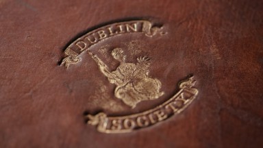 An imprint of the Dublin Society stamp on a leather covering