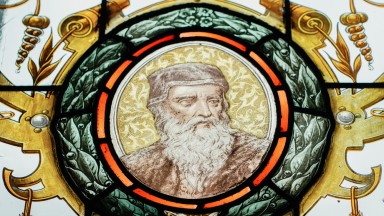 A detail of a stained glass window featuring Leonardo Da Vinci in the NLI's Main Library Building