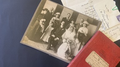 Collection of items, incouding photograph, book and letter
