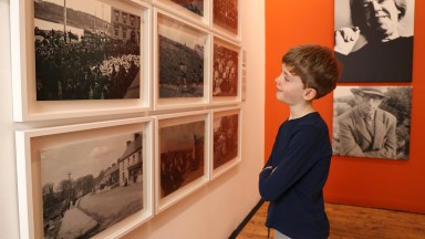 Image of boy looking at exhibition wall