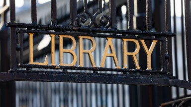 Library signage on gate