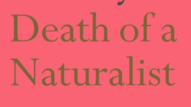 Red background cover of book entitled 'Death of a Naturalist' in gold writing. 