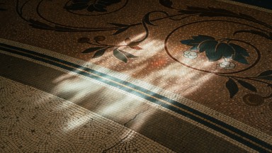 shadows moving across a mosaic floor
