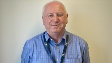 Portrait photograph of John O'Sullivan