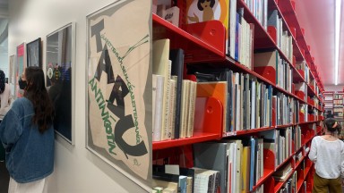 Image of people in corridor on left and in book stacks on right